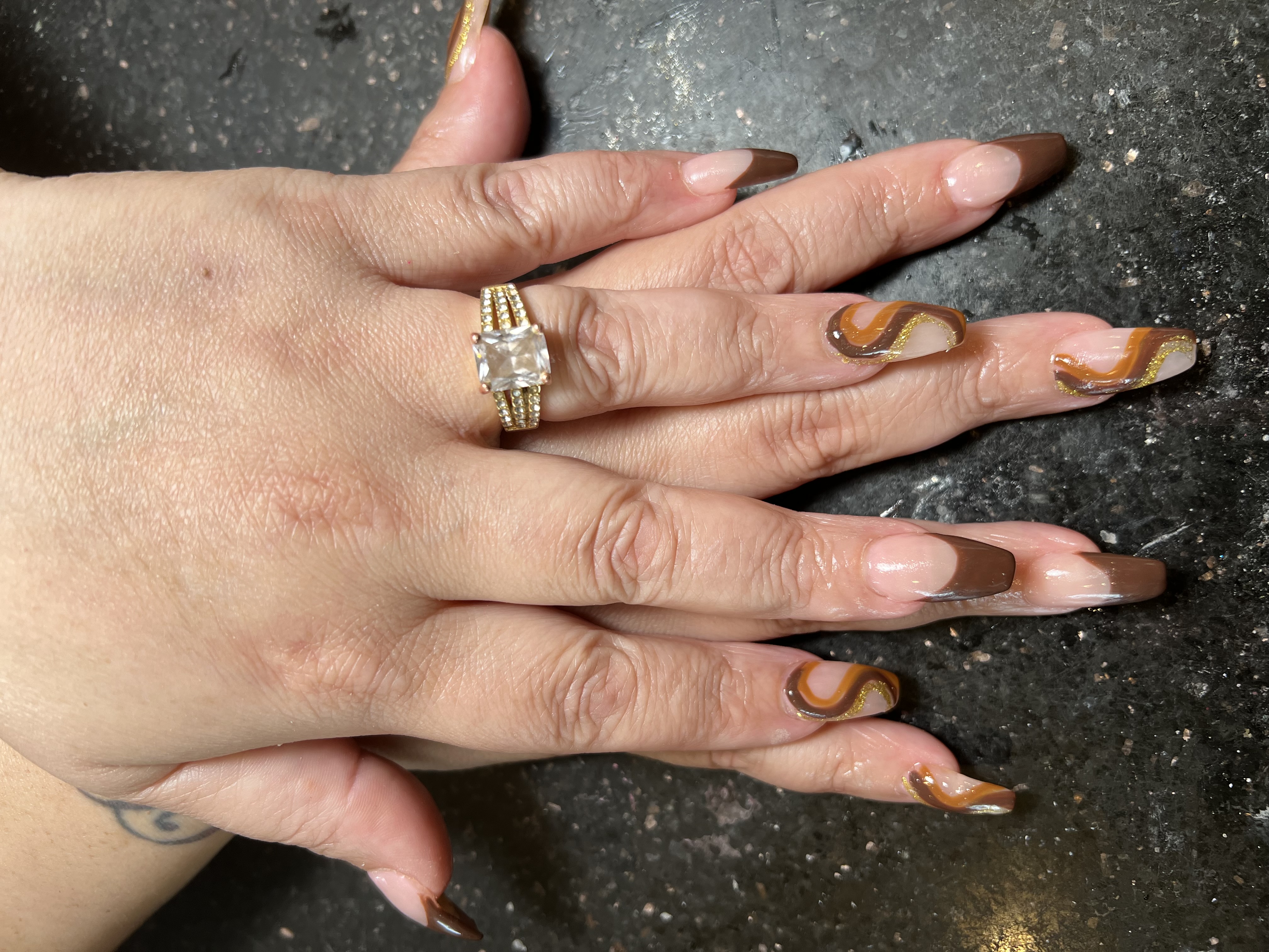 Brown caramel swirl nails